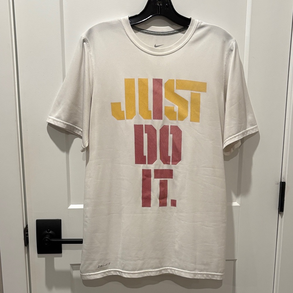 Nike White shirt featuring bold “Just Do it” in red and yellow graphics
